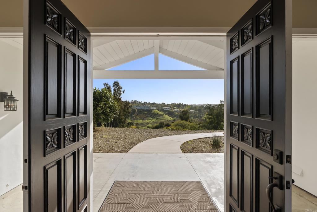 16551 Zumaque Street Rancho Santa Fe, CA 92067 - Photo 3 of 11 a view of a entryway door front of house