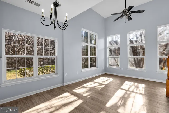 a view of an empty room with windows