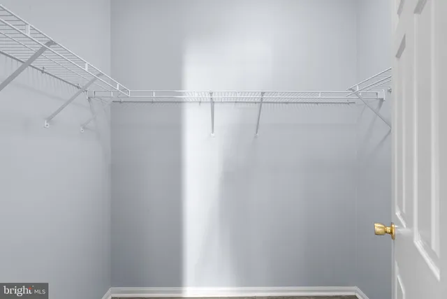 a view of a room with racks on the wall