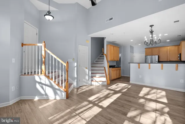 a view of a living room and entryway