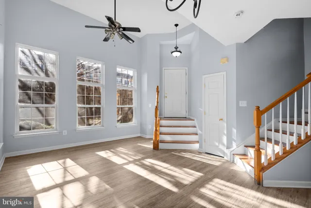 a view of an entryway with wooden floor and door