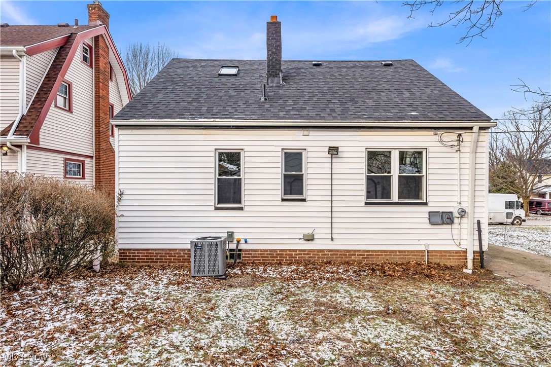 953 Whitby Road Cleveland Heights, OH 44112 - Photo 27 of 27 Back of house featuring a chimney and roof with shingles