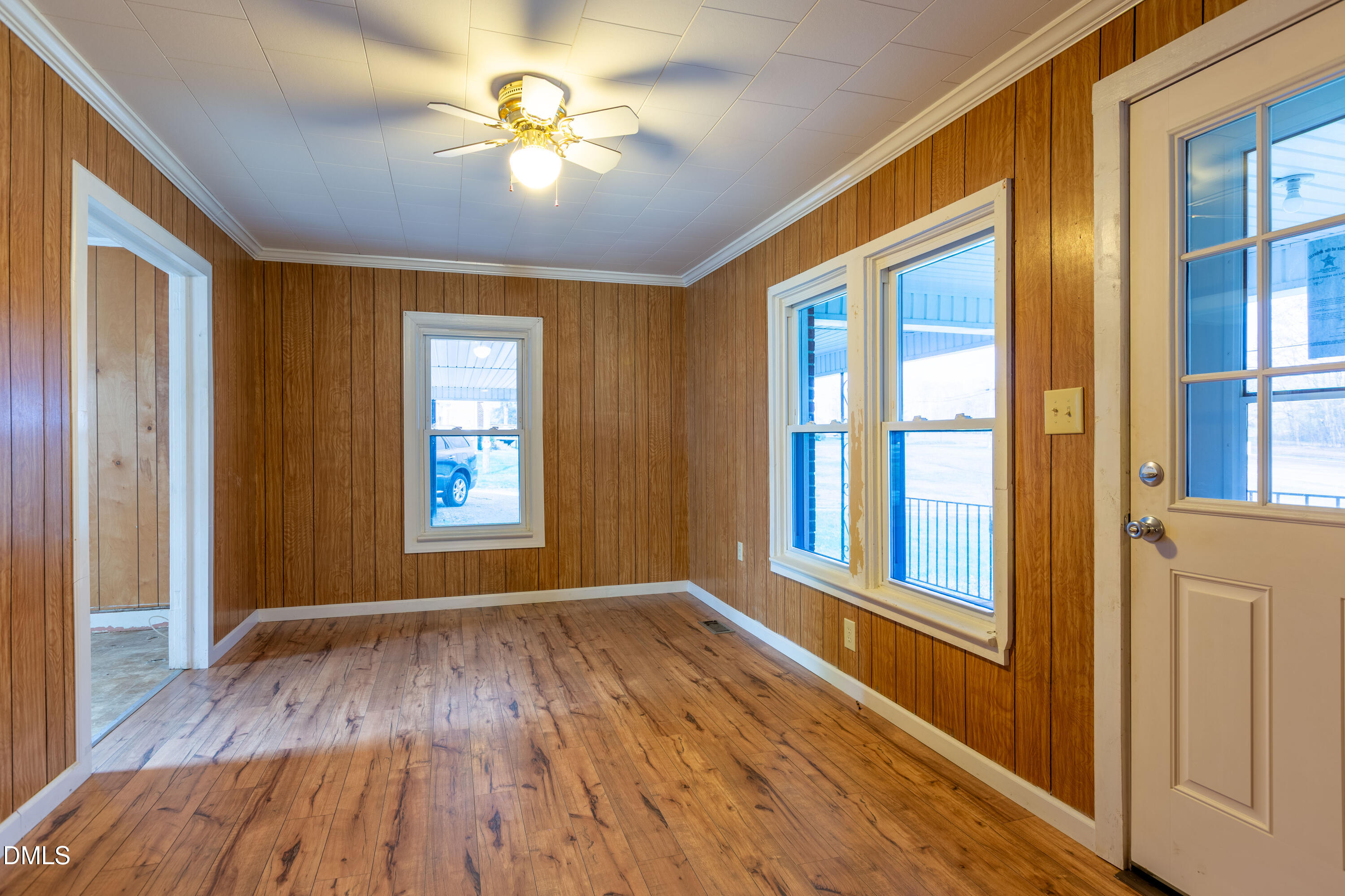 4295 Virgilina Road Roxboro, NC 27574 - Photo 4 of 46 wooden floor in an empty room with a window