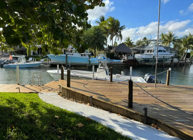 a view of a swimming pool with lounge chairs