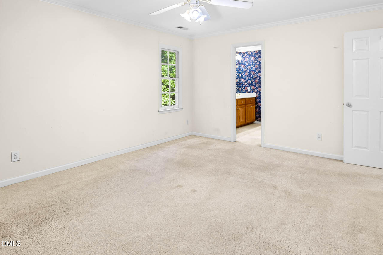 2209 Lodestar Drive Raleigh, NC 27615 - Photo 28 of 50 an empty room with windows and cabinet