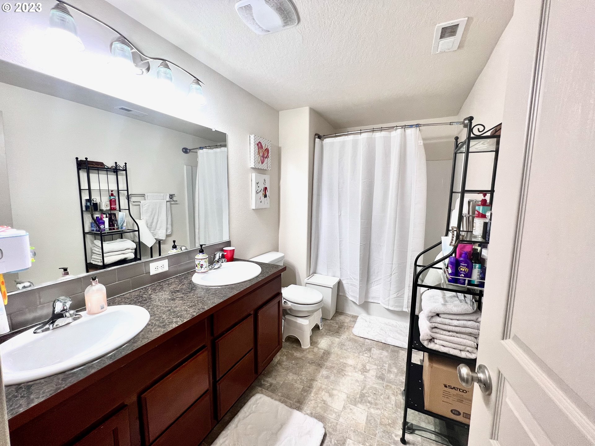 4686 Rocky Road Springfield, OR 97478 - Photo 16 of 25 a bathroom with a sink vanity mirror and toilet