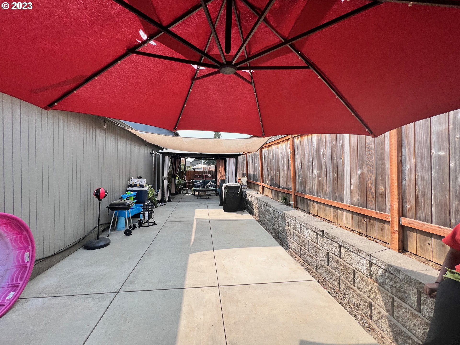4686 Rocky Road Springfield, OR 97478 - Photo 21 of 25 a view of a patio with table and chairs under an umbrella