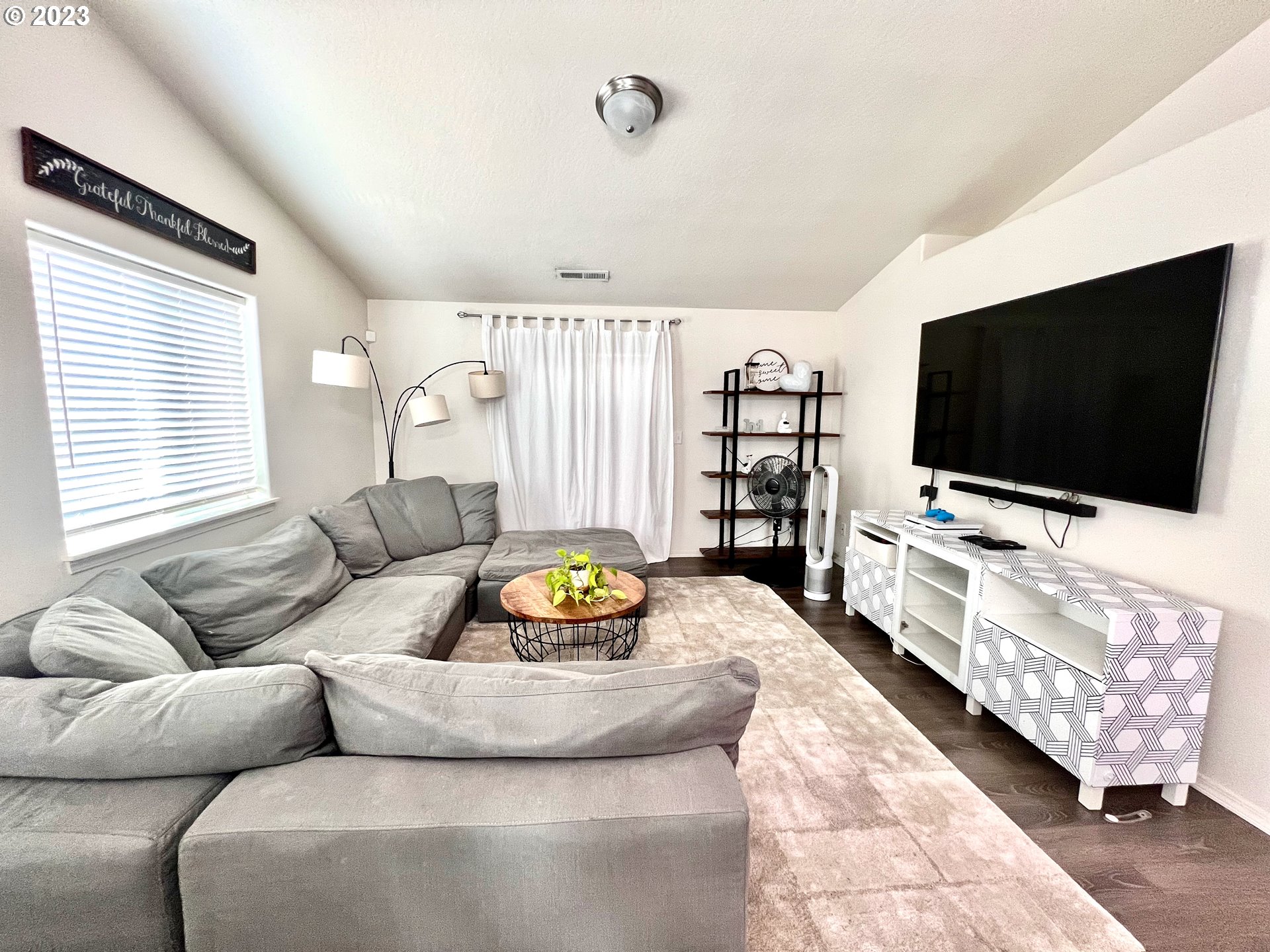 4686 Rocky Road Springfield, OR 97478 - Photo 5 of 25 a living room with furniture and a flat screen tv