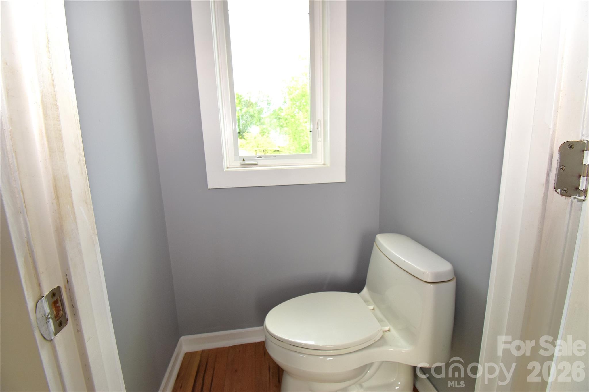 6 Belvedere Road Asheville, NC 28803 - Photo 32 of 33 a white toilet sitting next to a window