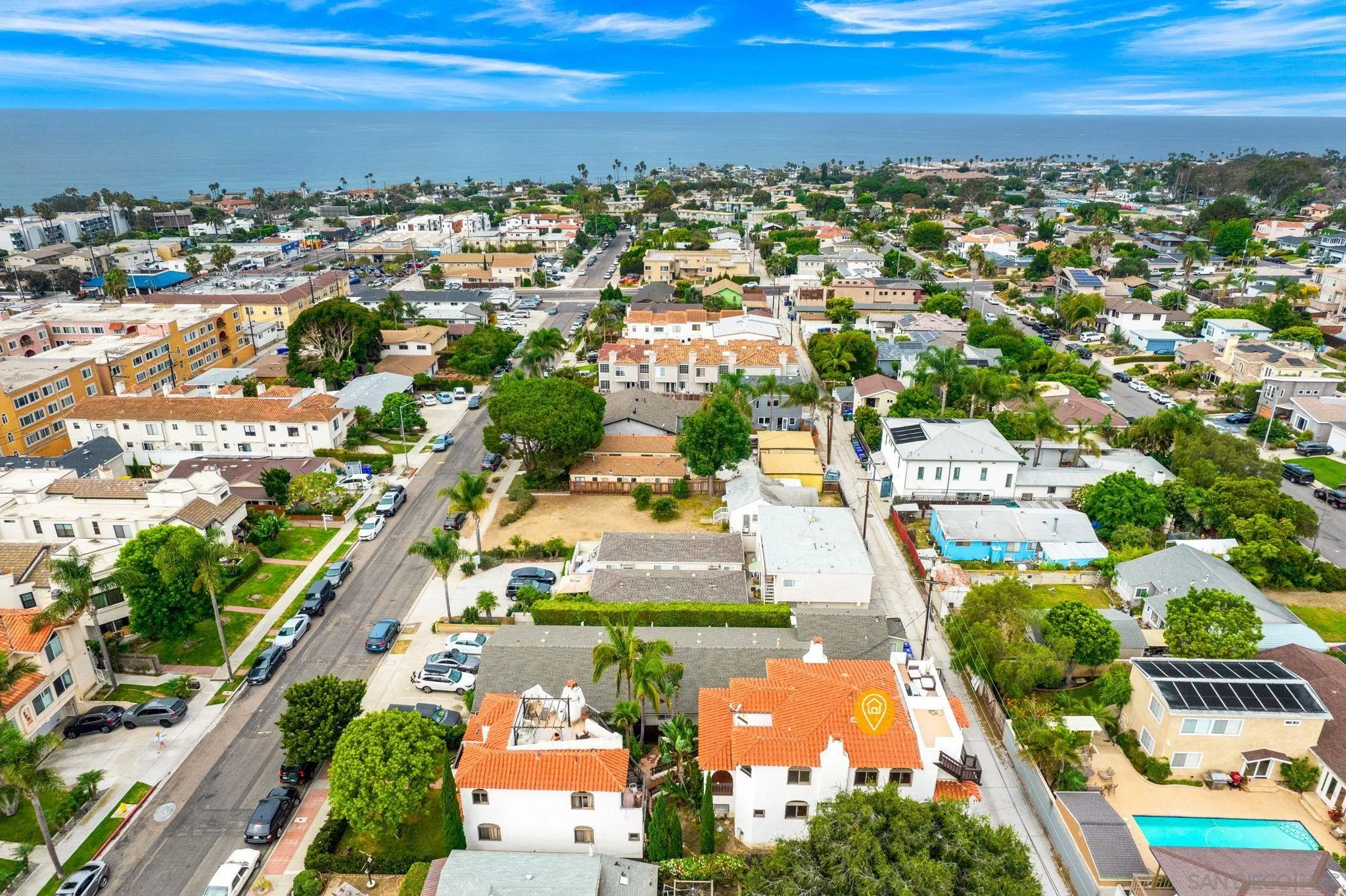 an aerial view of residential houses with outdoor space