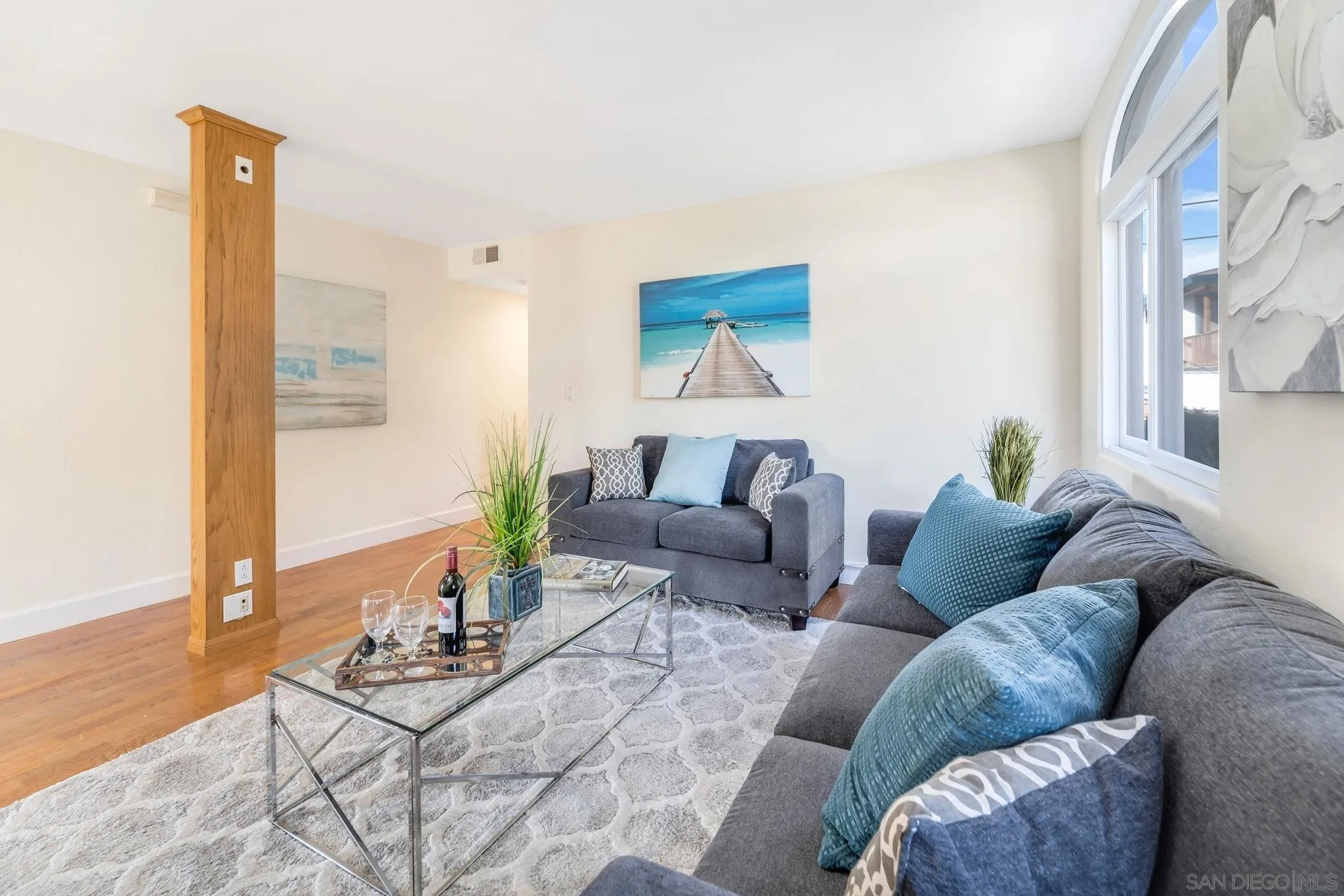 914 Agate Street, Unit E San Diego, CA 92109 - Photo 17 of 24 a living room with furniture and wooden floor