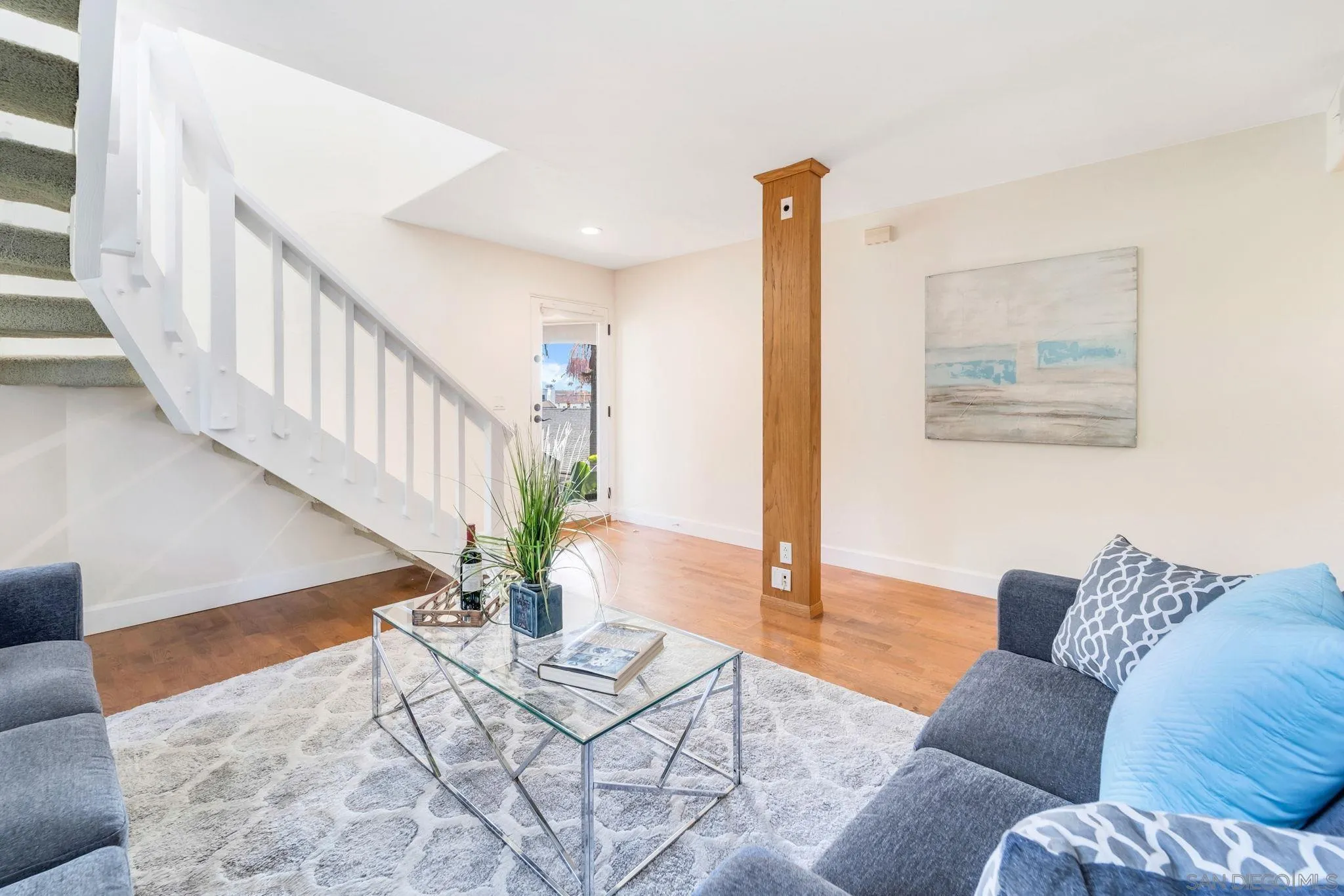 914 Agate Street, Unit E San Diego, CA 92109 - Photo 18 of 24 a living room with furniture and wooden floor