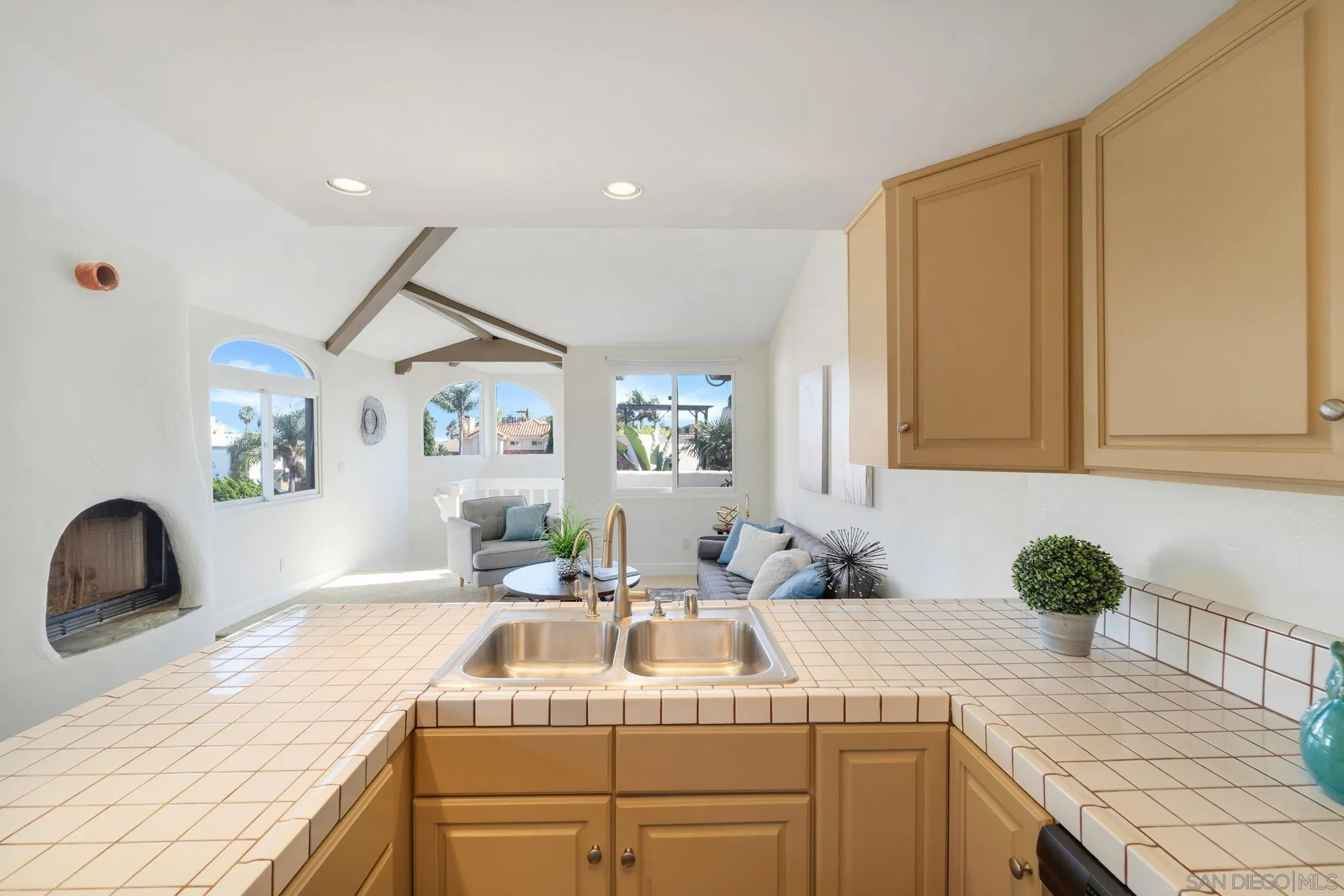 914 Agate Street, Unit E San Diego, CA 92109 - Photo 2 of 24 a kitchen with a sink stove and cabinets