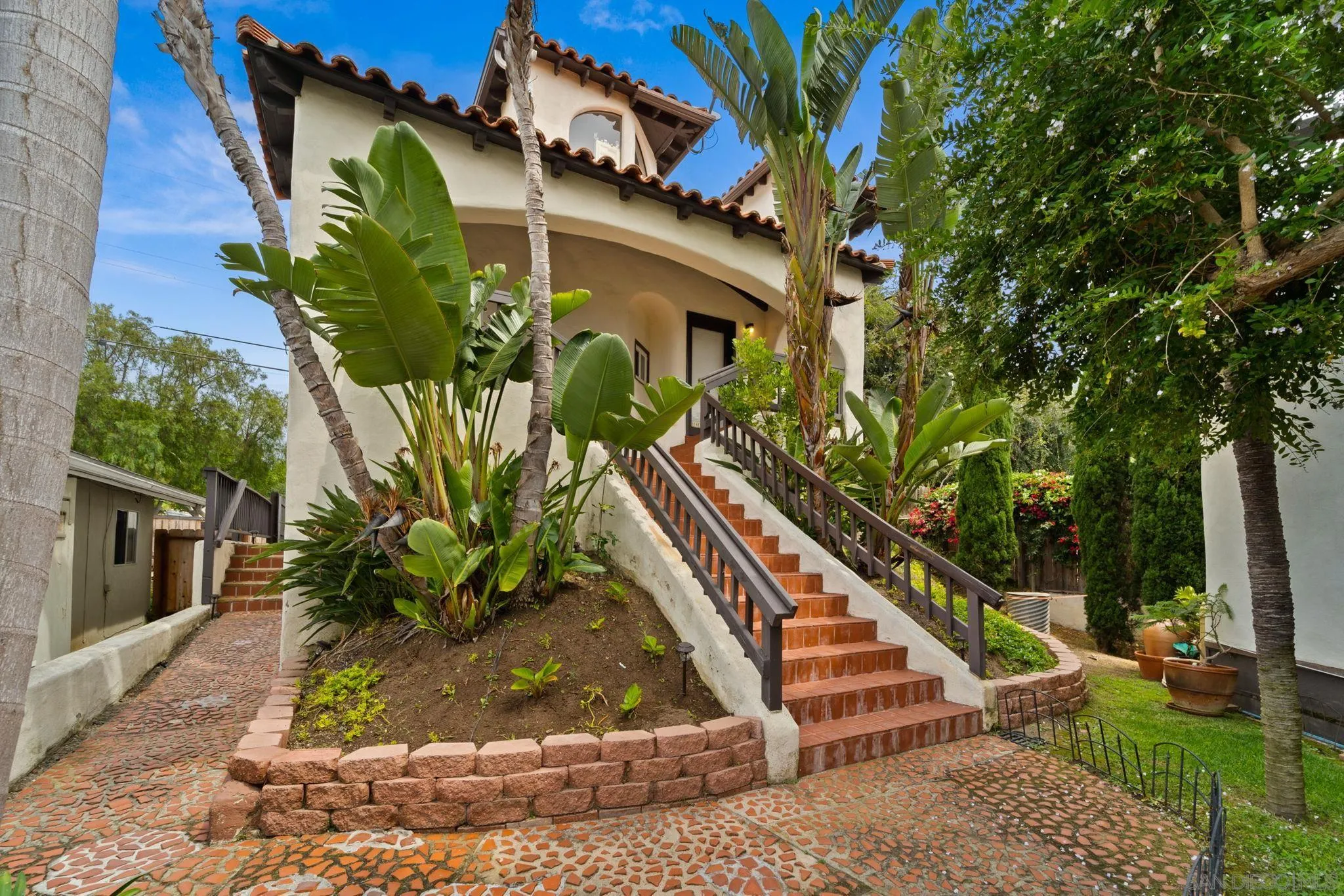 914 Agate Street, Unit E San Diego, CA 92109 - Photo 21 of 24 a view of a house with a yard