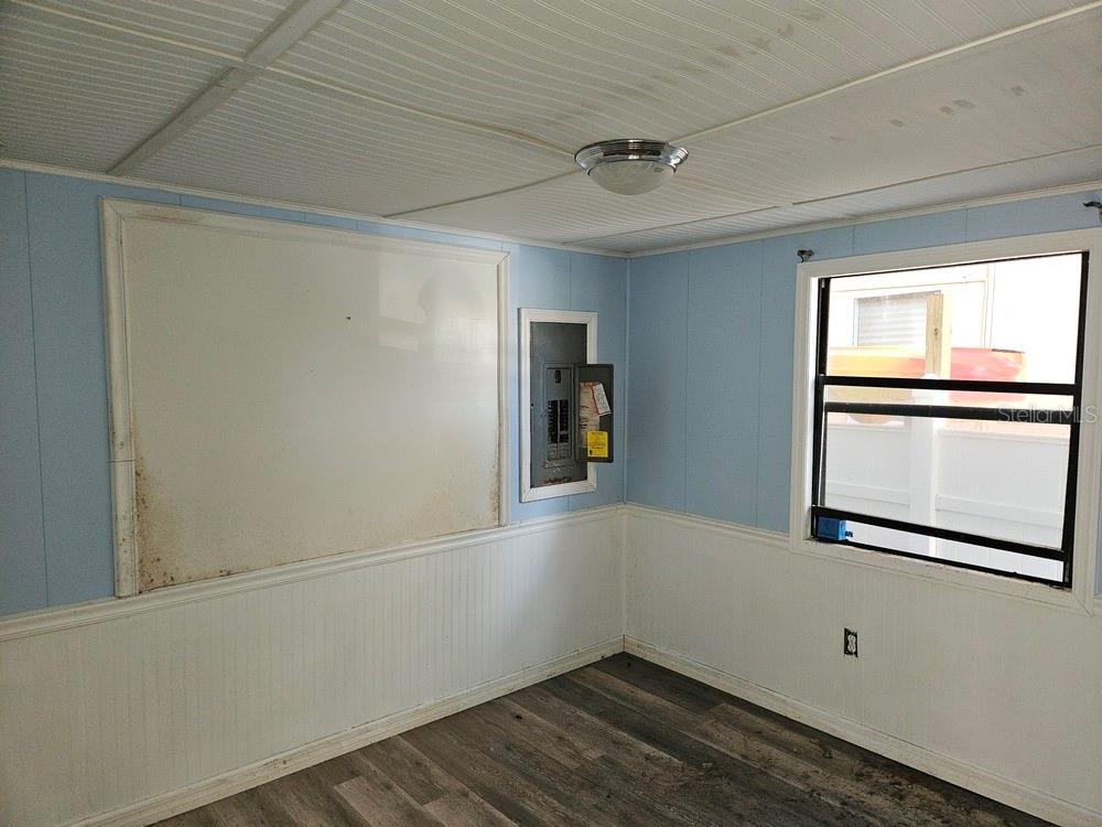 5281 Tuna Lane Weeki Wachee, FL 34607 - Photo 15 of 16 a view of empty room with wooden floor