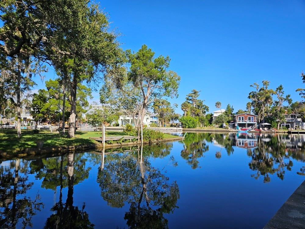 5281 Tuna Lane Weeki Wachee, FL 34607 - Photo 3 of 16 a view of a lake with houses