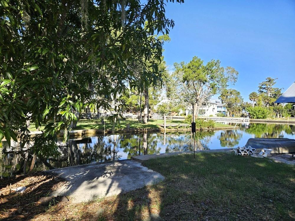 5281 Tuna Lane Weeki Wachee, FL 34607 - Photo 7 of 16 a view of a lake with houses
