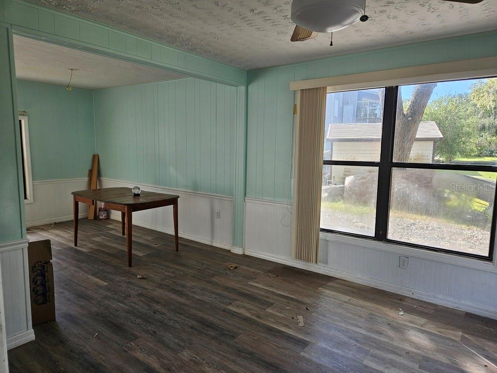 5281 Tuna Lane Weeki Wachee, FL 34607 - Photo 10 of 16 a view of a room with furniture window and wooden floor