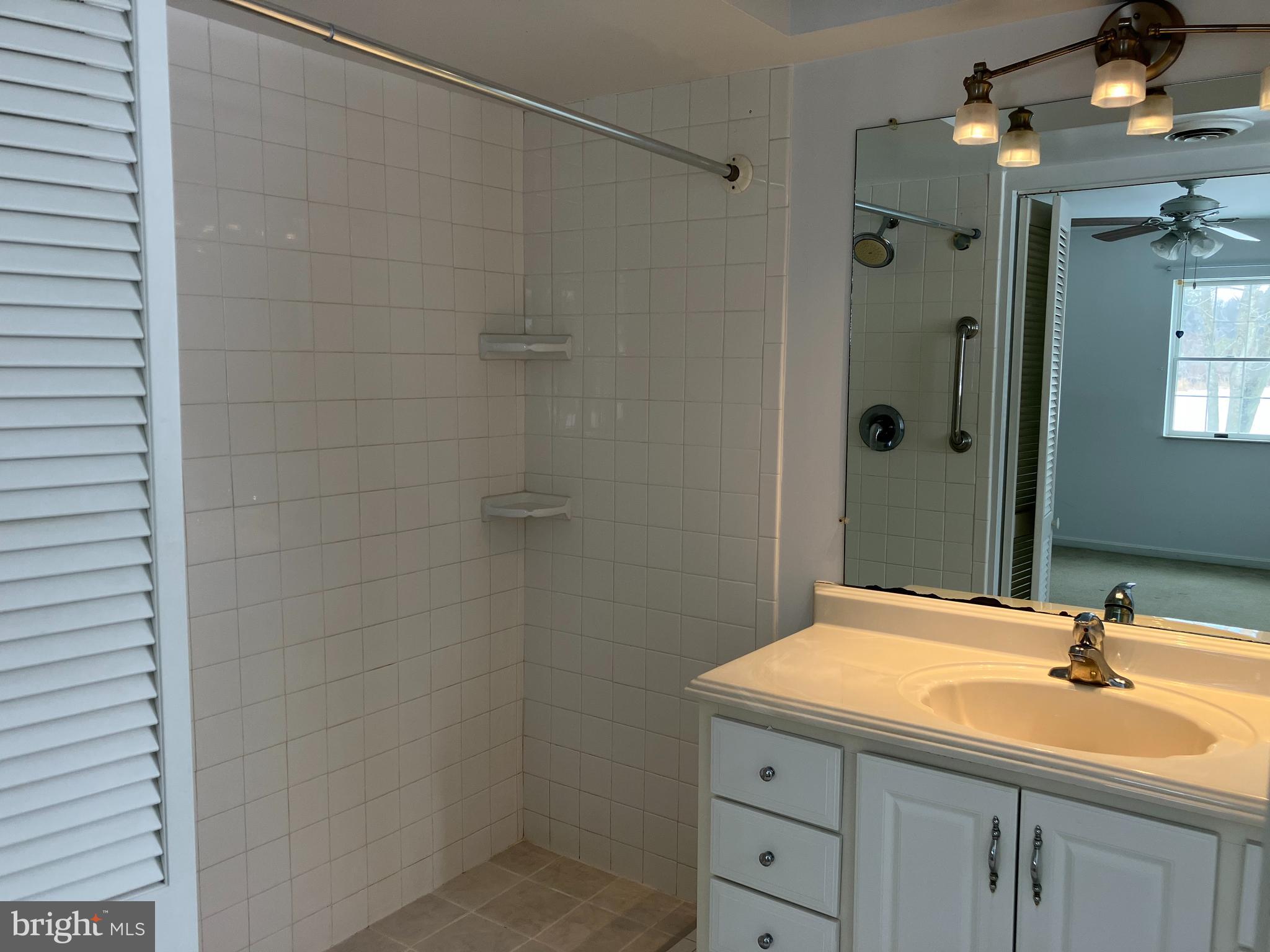 21336 Haven Road Rock Hall, MD 21661 - Photo 15 of 29 a bathroom with a sink and a mirror