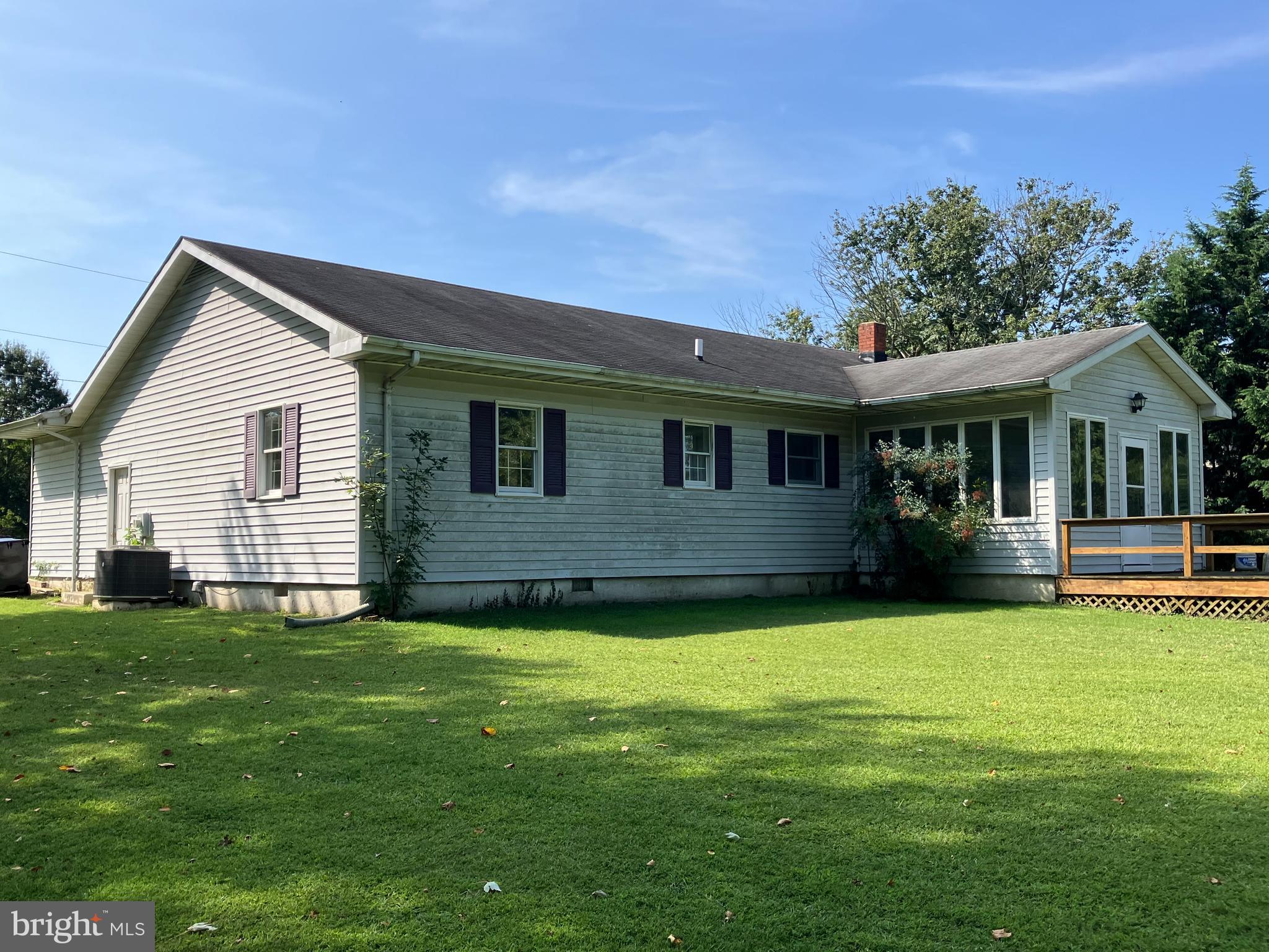 21336 Haven Road Rock Hall, MD 21661 - Photo 2 of 29 a view of a house with a yard and deck