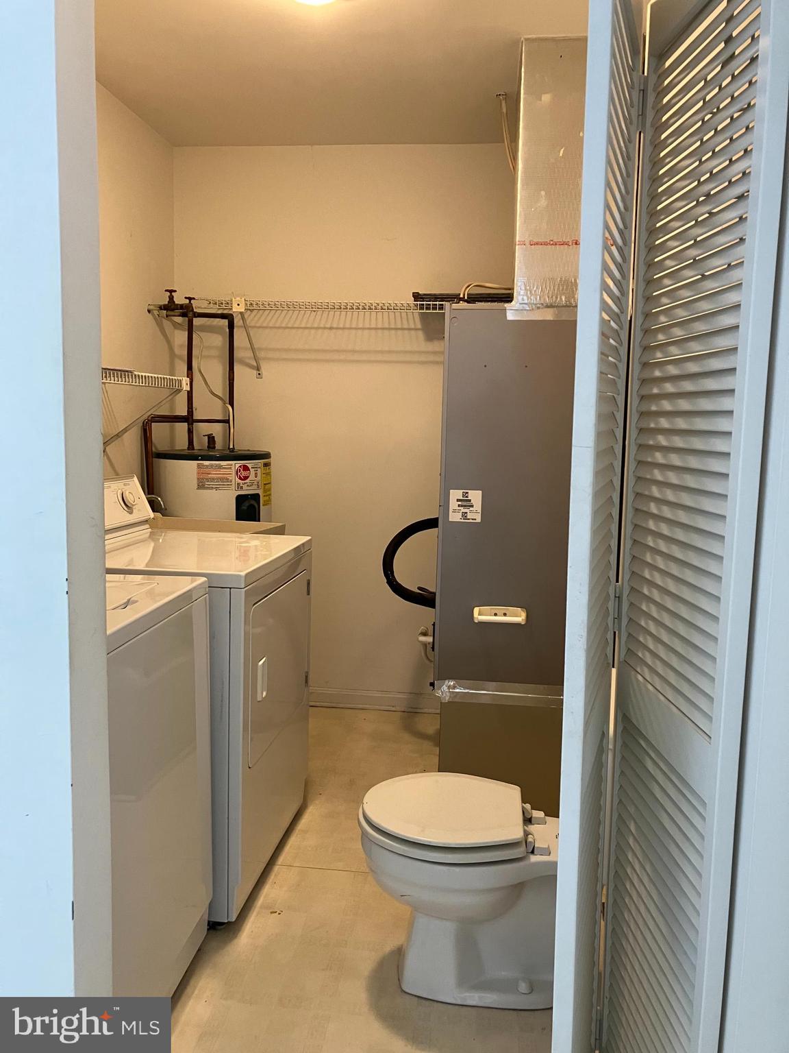 21336 Haven Road Rock Hall, MD 21661 - Photo 22 of 29 a bathroom with a toilet a sink and mirror