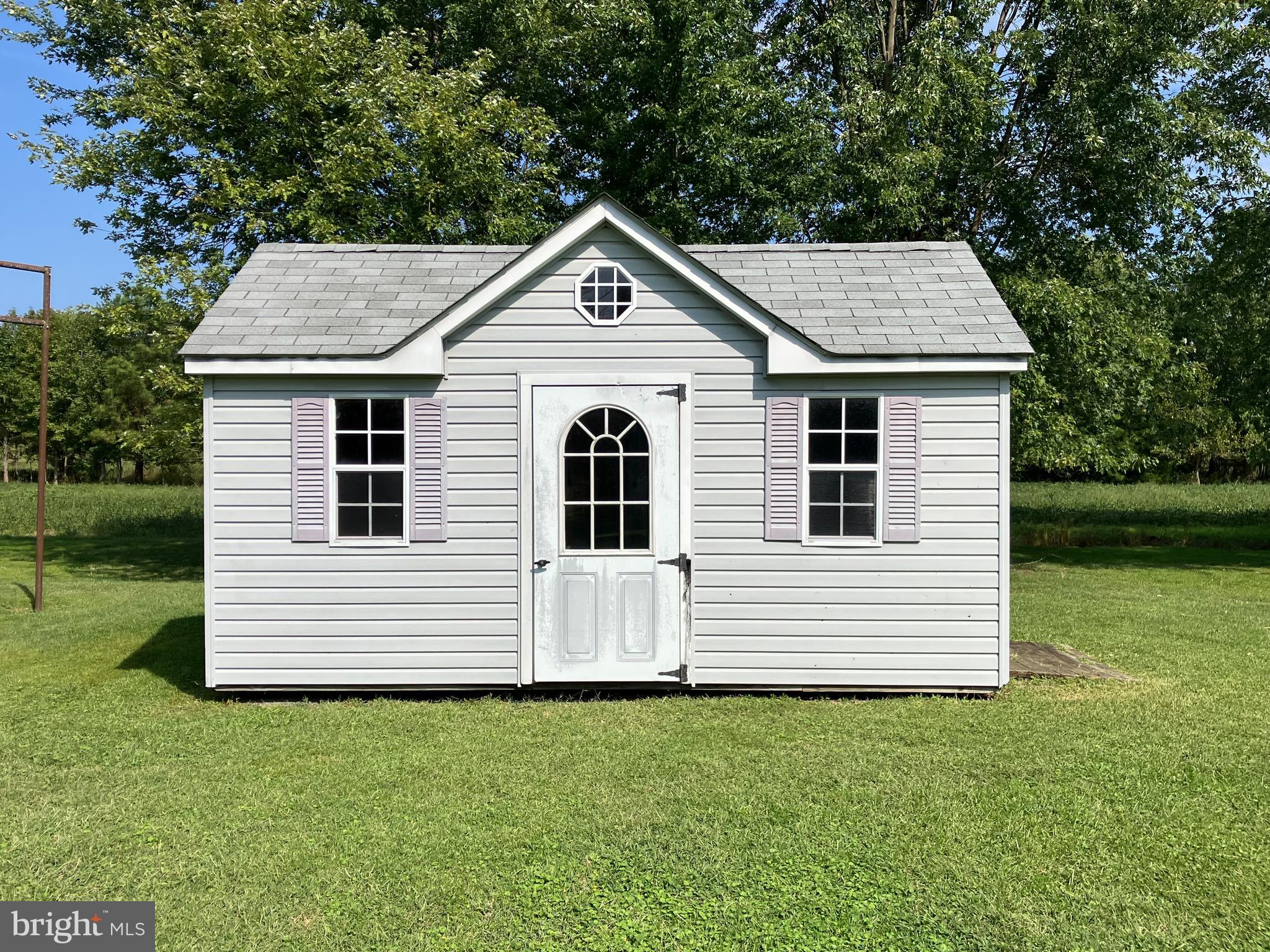 21336 Haven Road Rock Hall, MD 21661 - Photo 27 of 29 a front view of a house with a yard