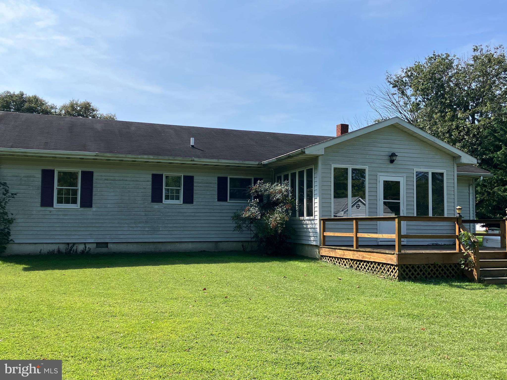 21336 Haven Road Rock Hall, MD 21661 - Photo 3 of 29 a front view of a house with a garden