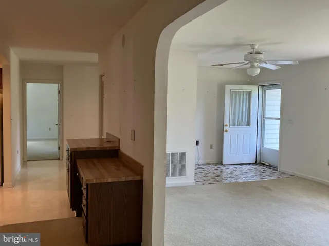 en suite bathroom with a granite countertop sink and a mirror