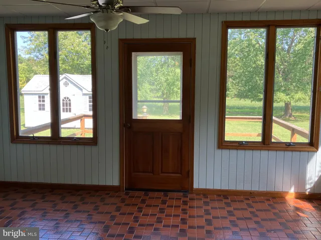a view of empty room with windows