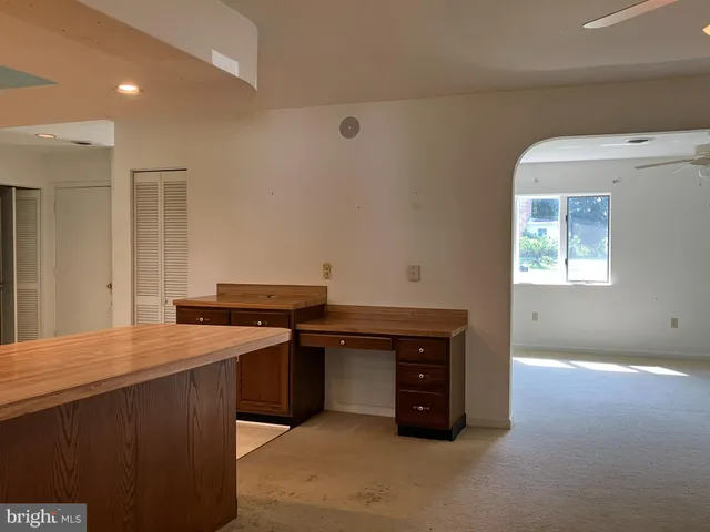 a kitchen with granite countertop a sink and a stove