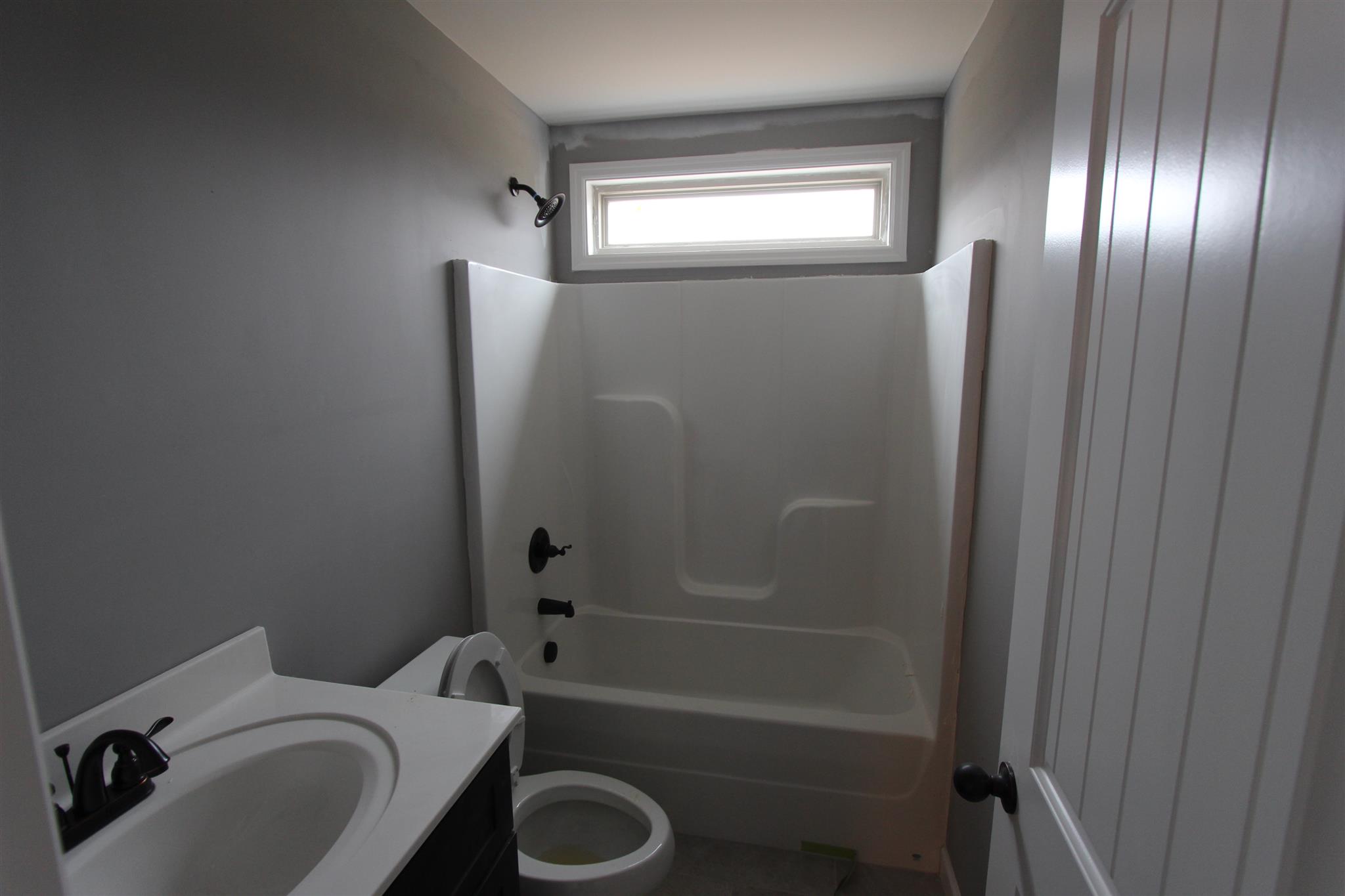 400 Beech Log Road Watertown, TN 37184 - Photo 16 of 22 a bathroom with a sink toilet and shower