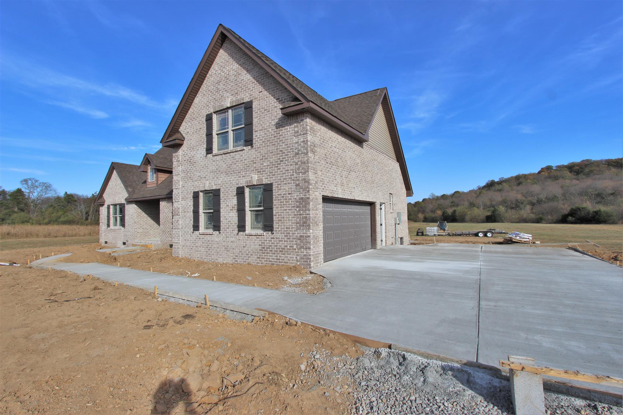 400 Beech Log Road Watertown, TN 37184 - Photo 3 of 22 a front view of a house with a yard and garage