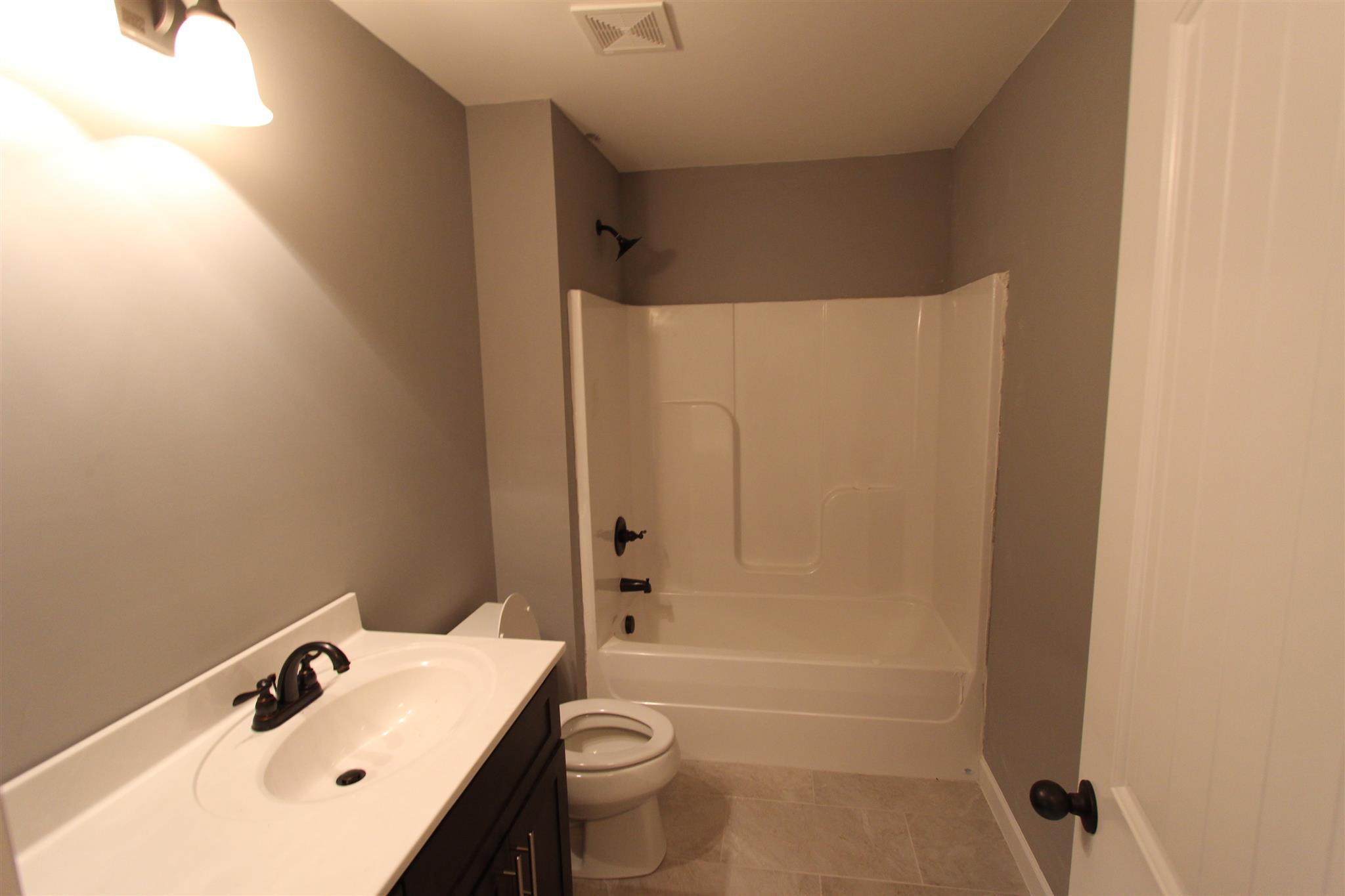 400 Beech Log Road Watertown, TN 37184 - Photo 21 of 22 a bathroom with a sink toilet and shower