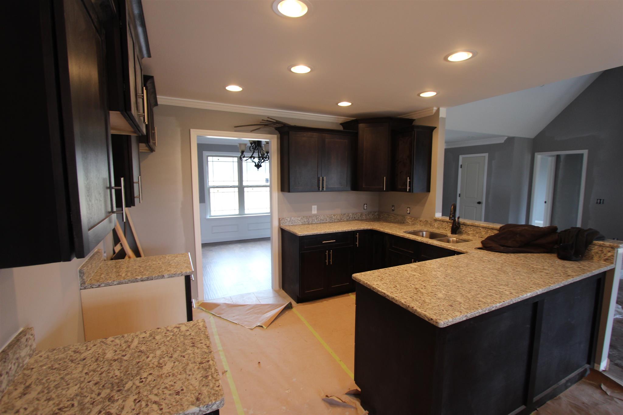 400 Beech Log Road Watertown, TN 37184 - Photo 8 of 22 a kitchen with a sink a stove and cabinets