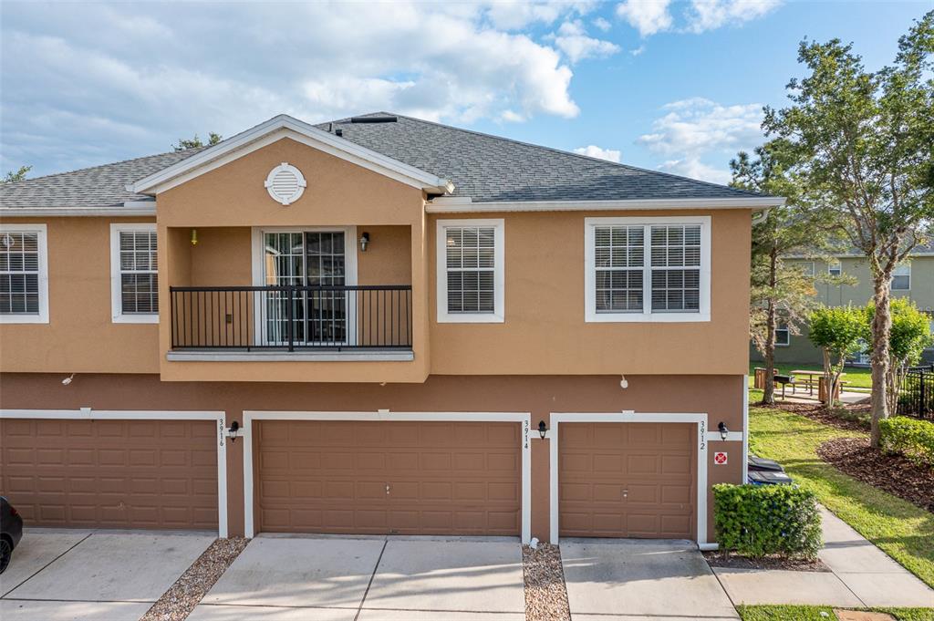 3912 Pemberly Pines Circle St. Cloud, FL 34769 - Photo 1 of 1 a front view of a house with a yard