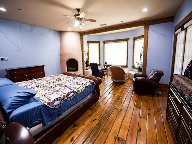 a bedroom with a bed and a chandelier