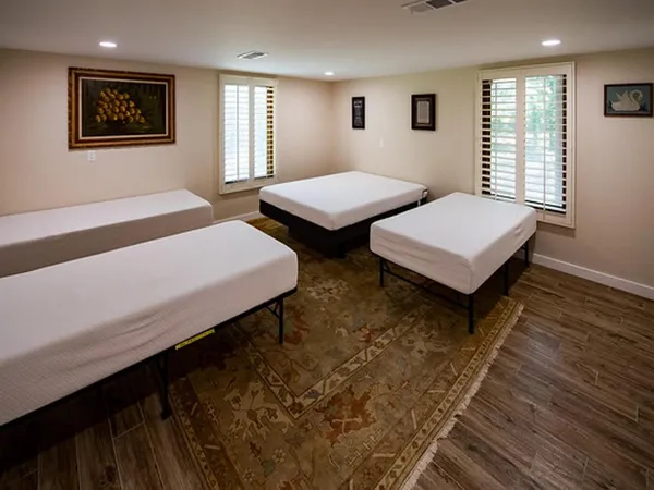 a bedroom with a bed and window