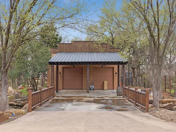 a bathroom with a granite countertop toilet sink and mirror