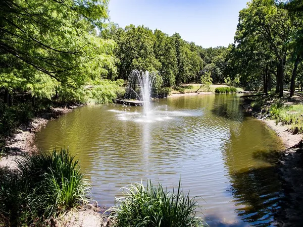 a view of a house with a yard table and chairs