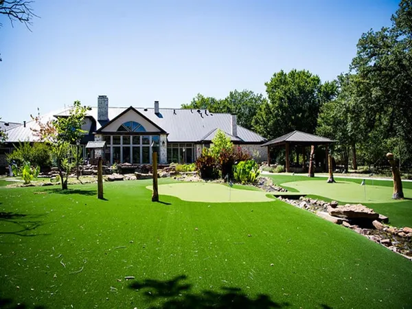 a view of a park with large trees