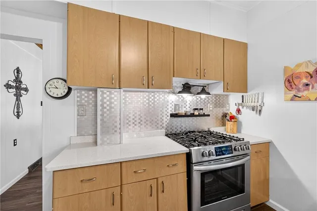 a kitchen with a stove and a refrigerator