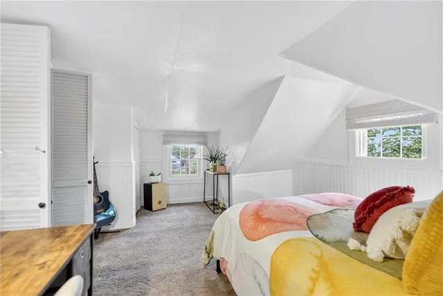 a bedroom with a bed and dresser