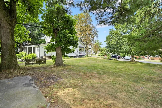 a view of a tree in front of a house