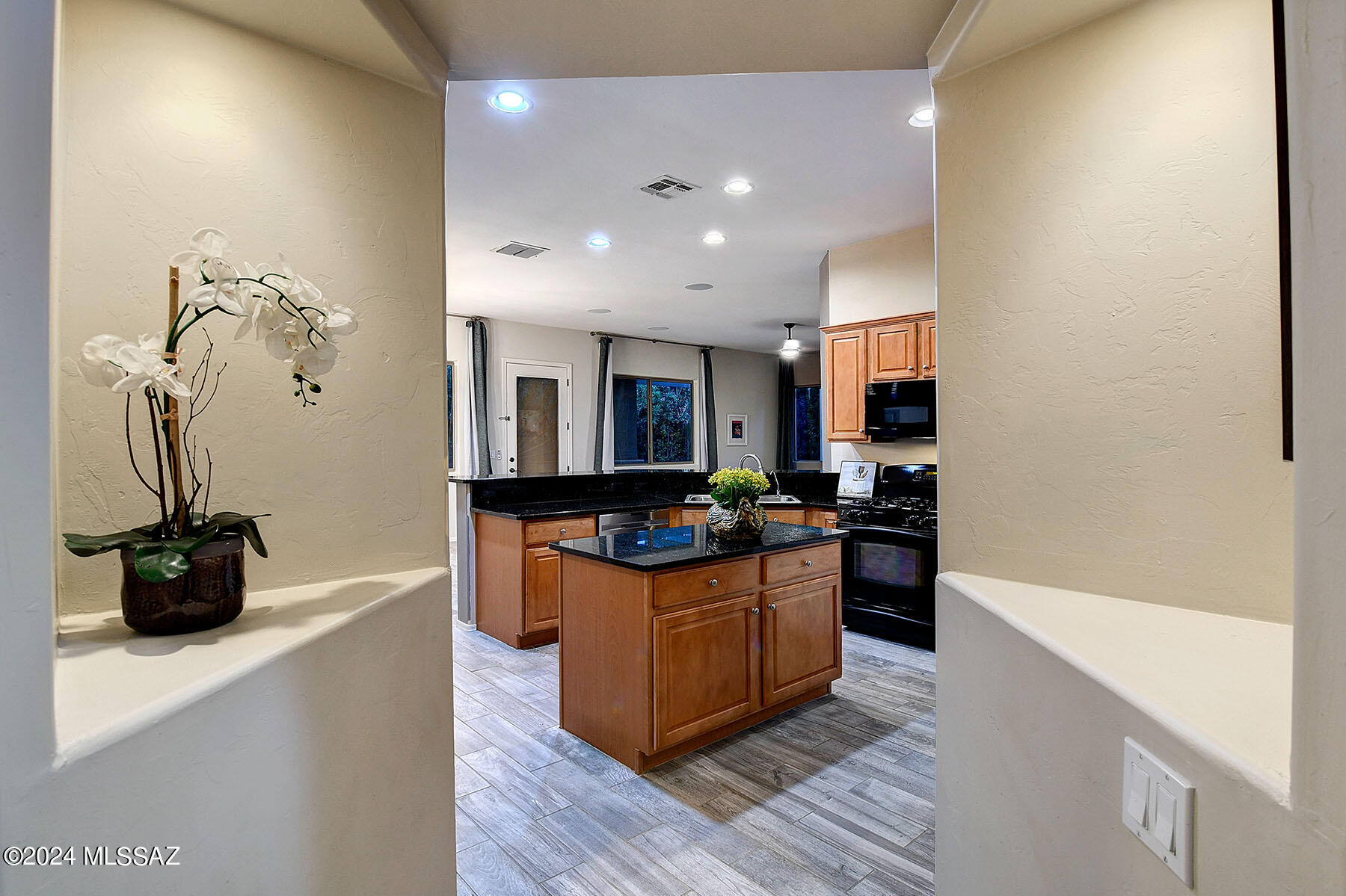 15084 North Pelham Road Tucson, AZ 85739 - Photo 10 of 40 a kitchen with stainless steel appliances granite countertop a stove and a sink