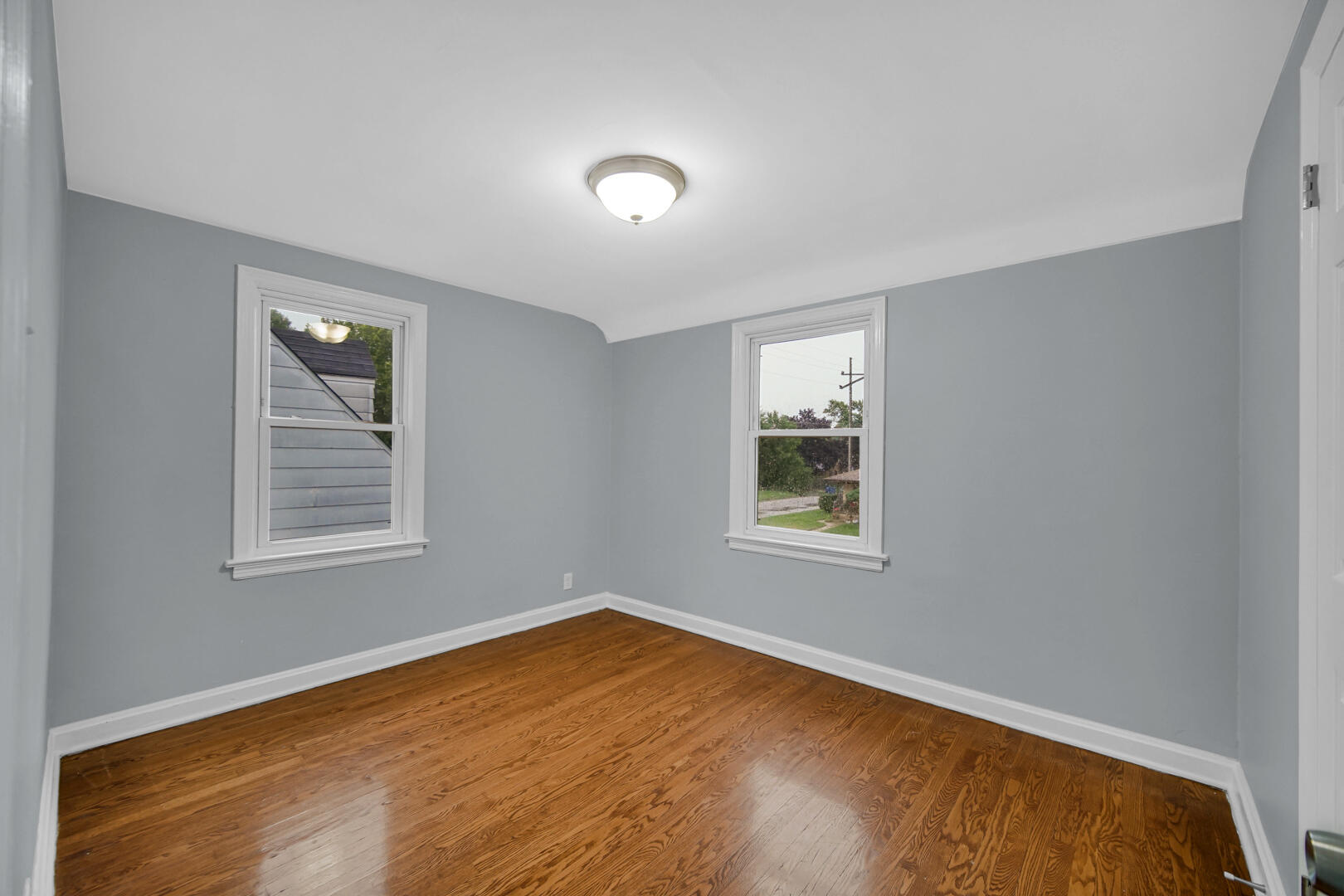 4810 Monroe Street Gary, IN 46408 - Photo 11 of 19 a view of an empty room with a window