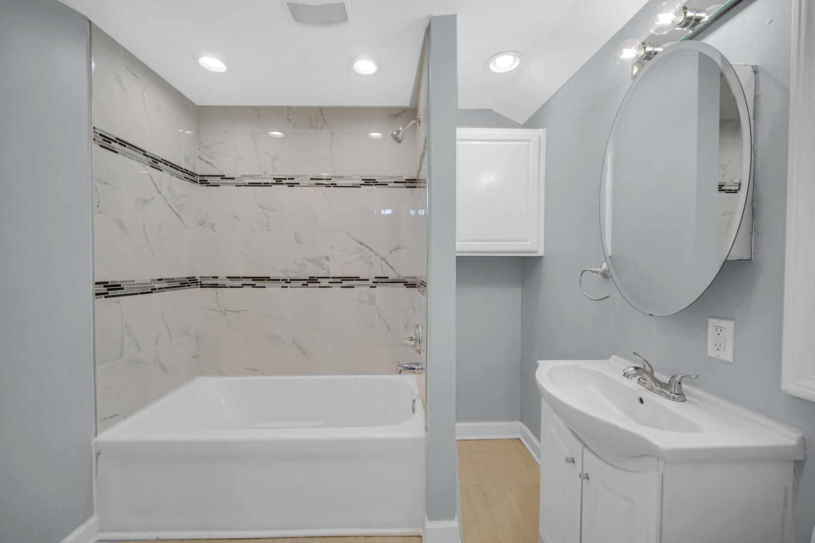 4810 Monroe Street Gary, IN 46408 - Photo 12 of 19 a bathroom with a tub sink shower and mirror