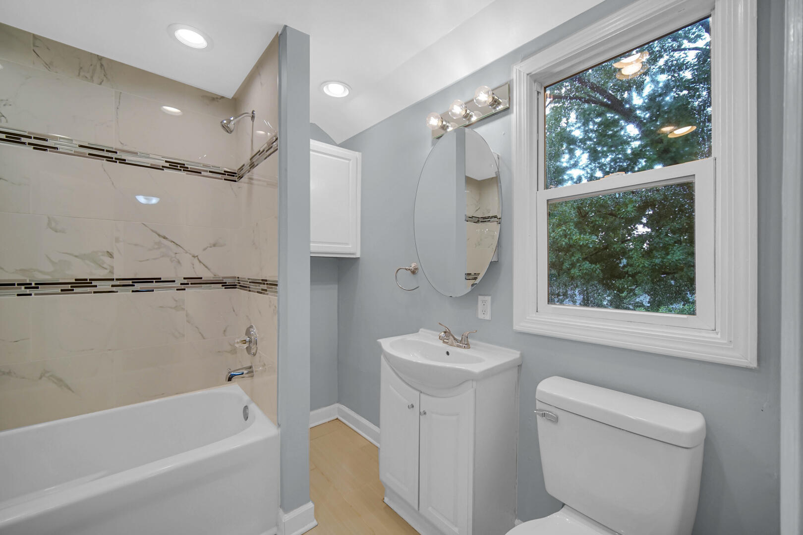 4810 Monroe Street Gary, IN 46408 - Photo 13 of 19 a bathroom with a bathtub a sink a toilet and a shower