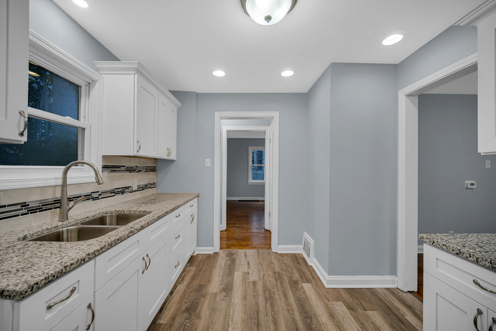 4810 Monroe Street Gary, IN 46408 - Photo 5 of 19 a kitchen with granite countertop a sink and a stove top oven