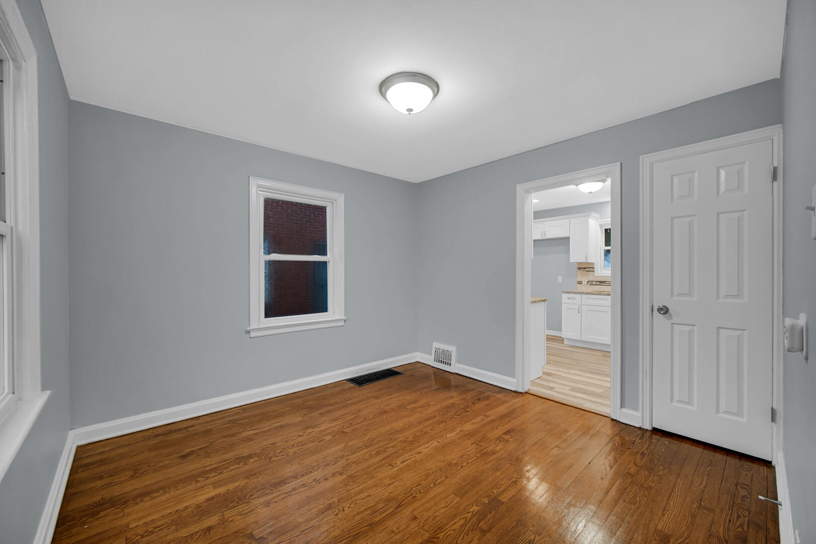 4810 Monroe Street Gary, IN 46408 - Photo 8 of 19 a view of empty room with wooden floor and fan