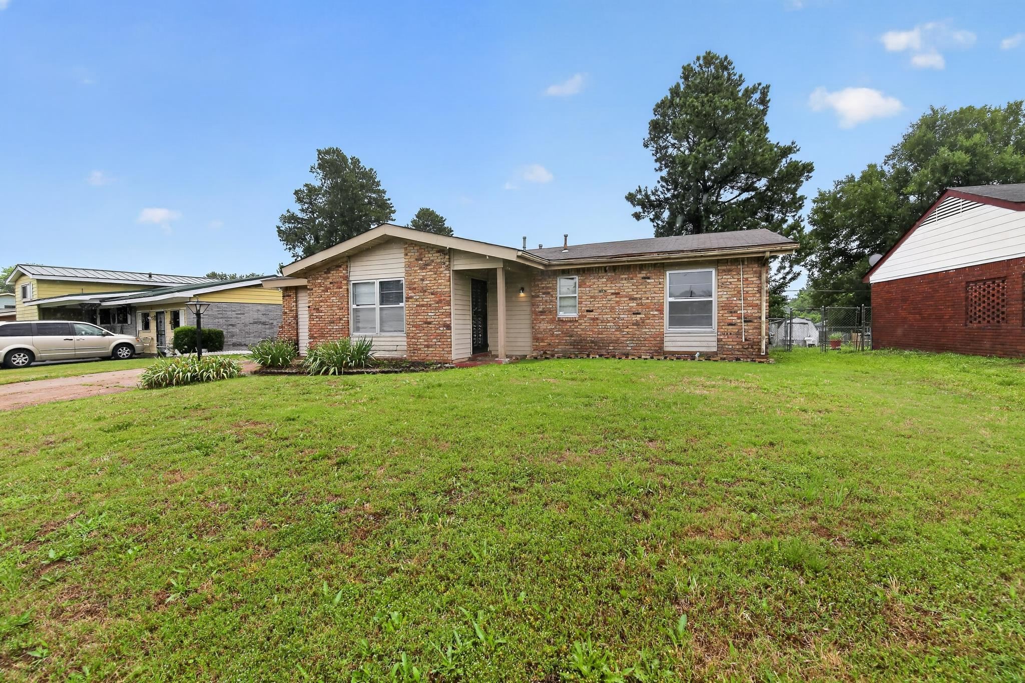 645 Parkrose Road Memphis, TN 38109 - Photo 2 of 32 Brick and siding exterior with a front entry, covered porch, and front yard landscaping